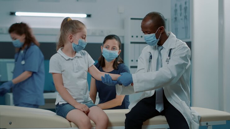 Doctor examining a child patient