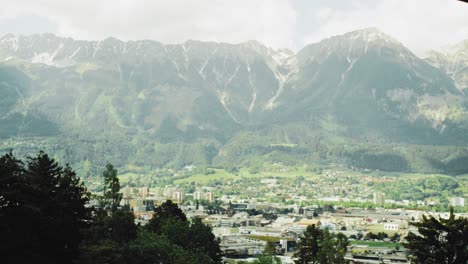 scenic view of the city innsbruck, tyrol with alpine mountains with parts of the old town and center