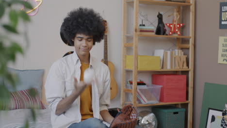 teenager playing catch in bedroom