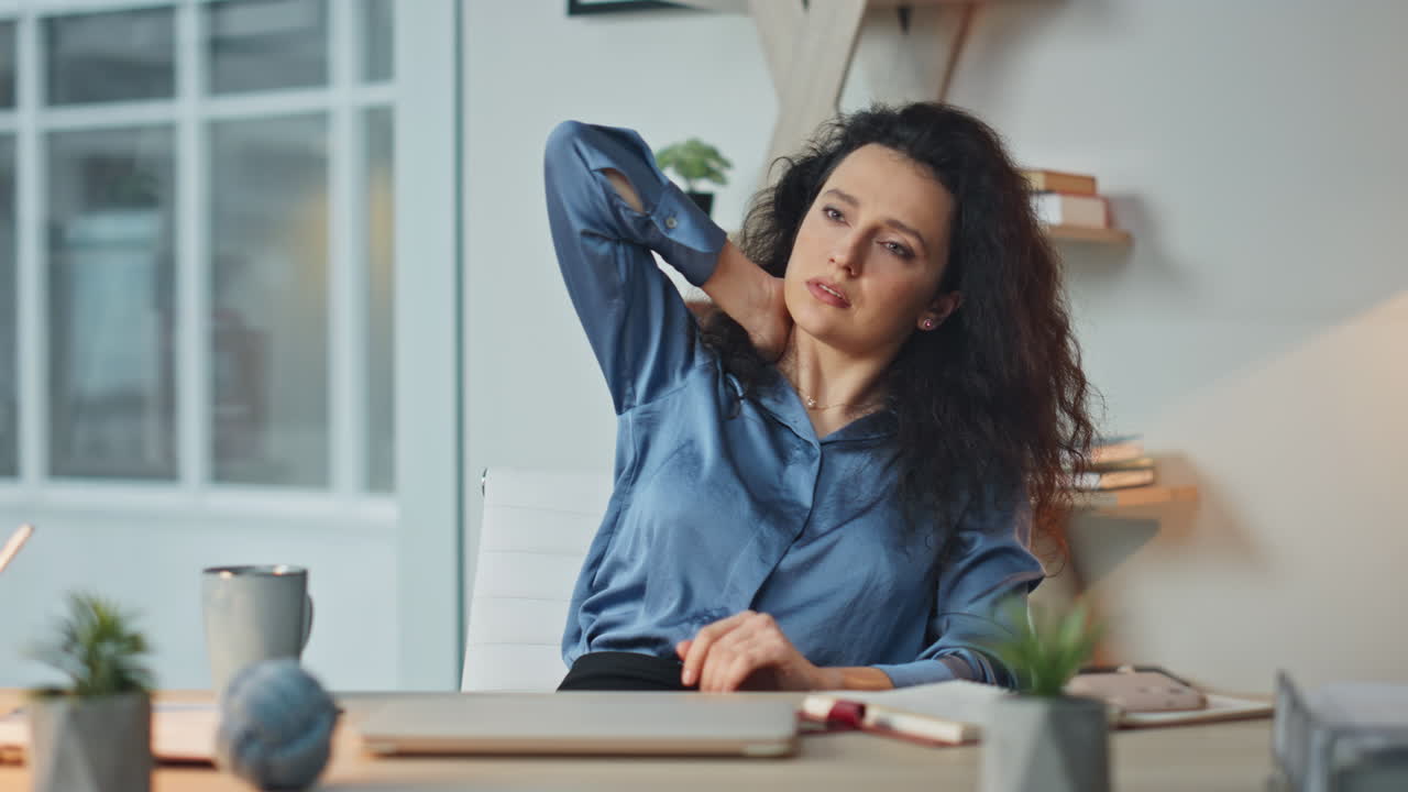 Professional woman rubbing neck at desk. Closeup tired executive taking break