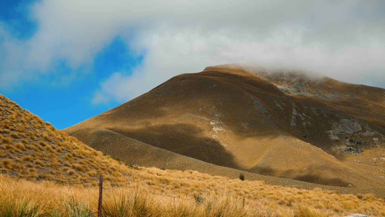Yellow Mountain's charm: Cloud shadows dance in captivating stock footage