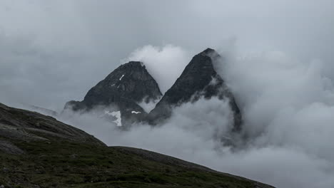 dramatic clouds form over norwegian mountains