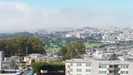 sweeping aerials reveal the grid-like layout of broadmoor’s tidy homes nestled between daly city’s rolling hills