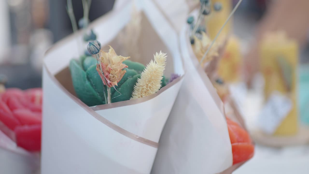 Close-up of decorative candles or gifts wrapped in paper