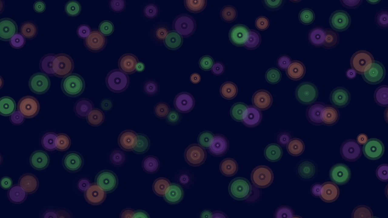 Colorful circles form a visually appealing pattern on a dark background in this image, creating a vibrant and symmetrical design that catches the eye