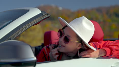 woman in a convertible car