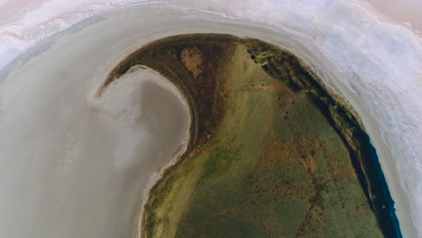 aerial view of a salt lake with island