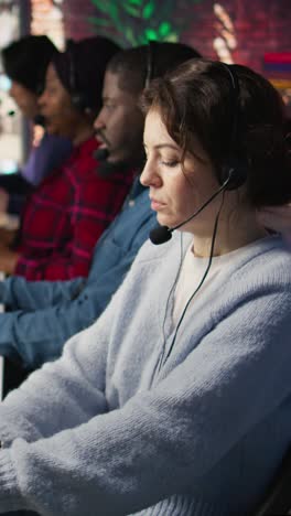 vertical video customer support workers assisting clients to meet outbound call quotas