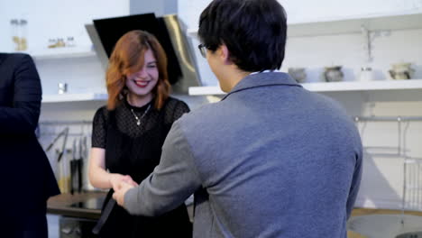 happy couple celebrating in a modern kitchen