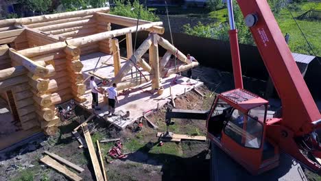 log cabin construction with crane