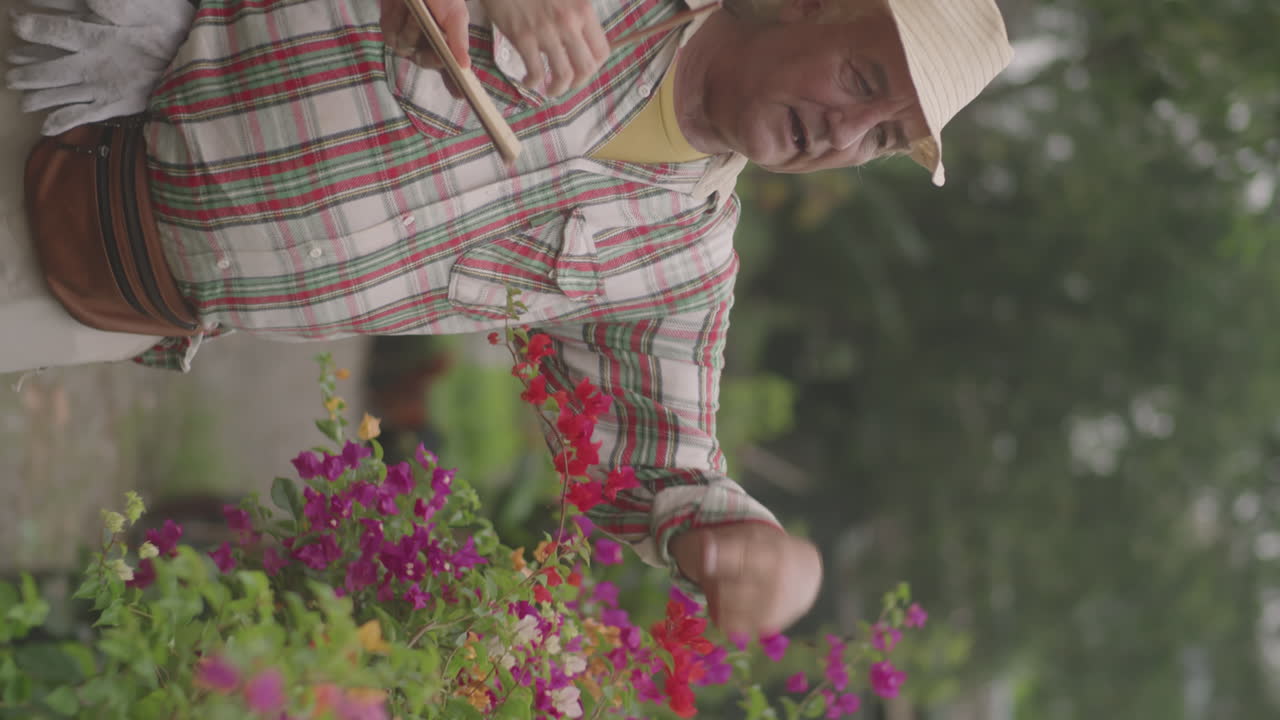 Nurseryman Telling Job Tasks to Female Colleague in Garden
