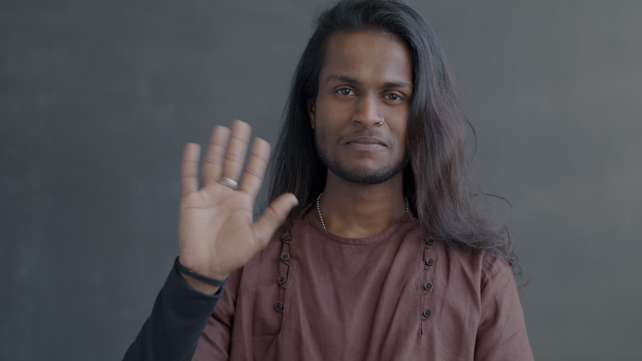 Man with Long Hair in Brown Shirt