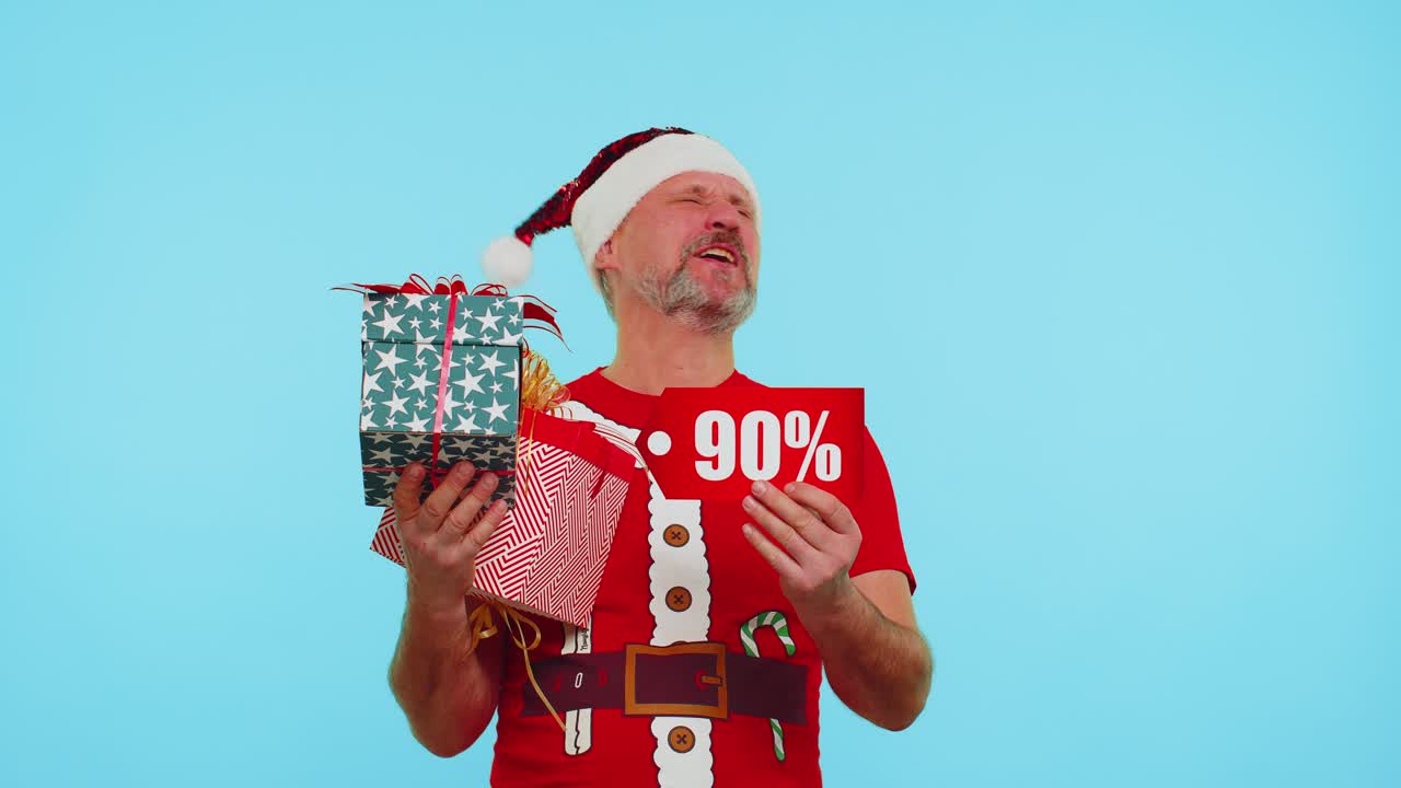 Man in red christmas tshirt showing gift box and 90 percent discount inscriptions banner text note
