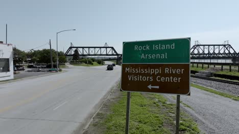 rock island arsenal sign and mississippi river visitors center sign in davenport, iowa with drone video stable