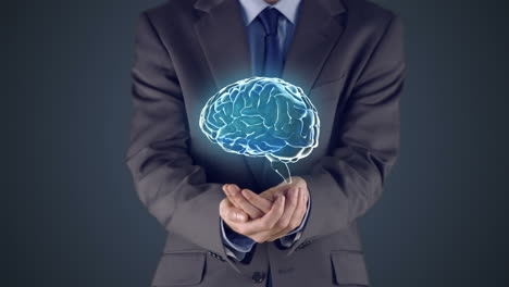 un hombre de negocios presenta el cerebro con las manos.