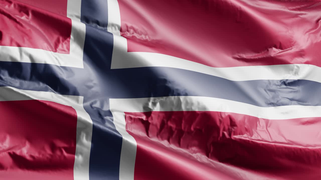 Norges flagg vaier i vinden (loop). Norsk banner svaier i brisen. Full bakgrunn. 10 sekunders loop.