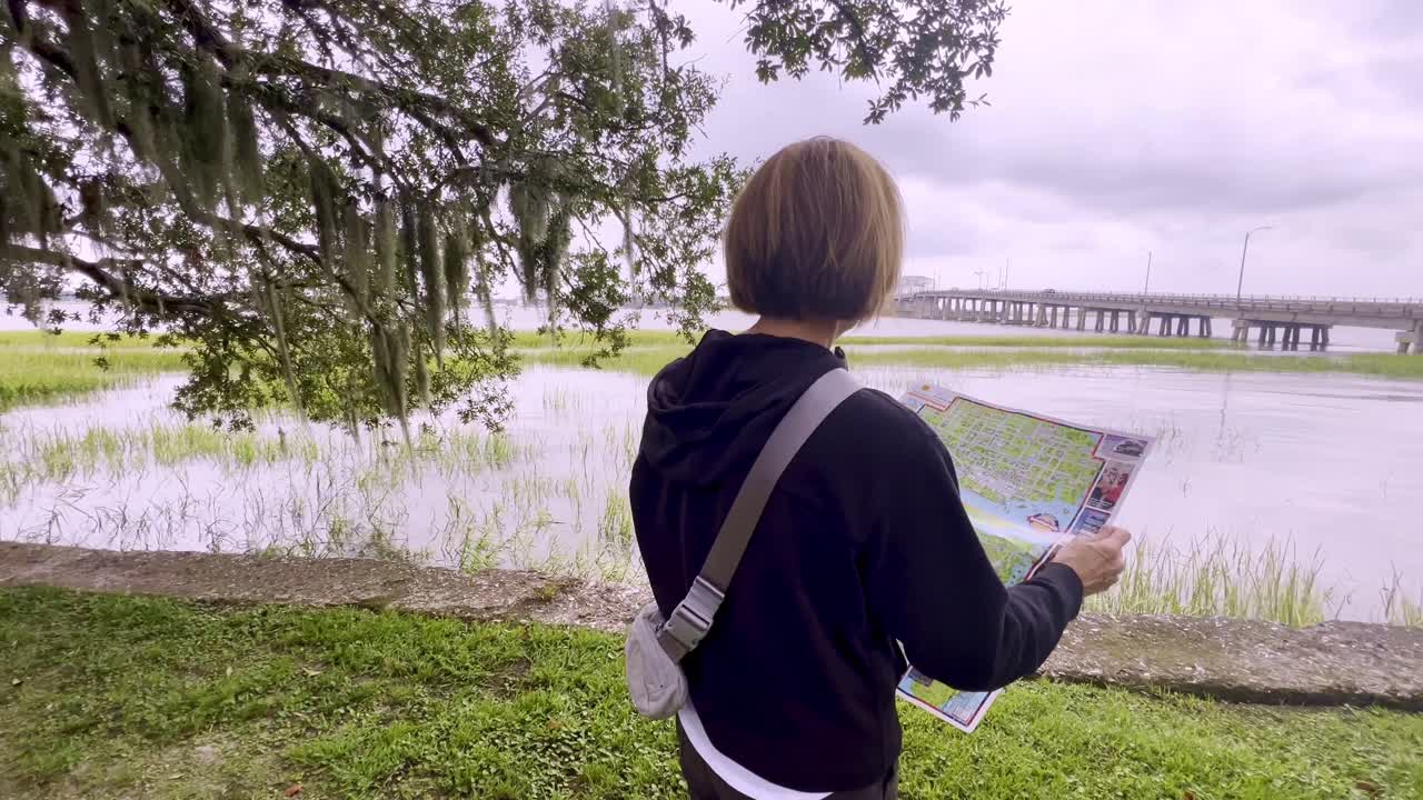 Tourist looks at map in Beaufort SC, South Carolina