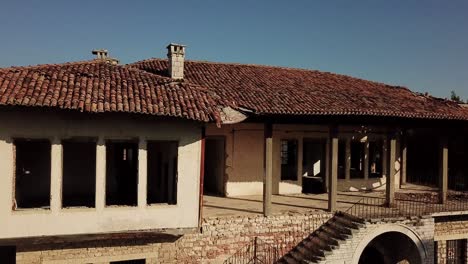 Drone-view-of-abandoned-building-in-Berat-Castle,-Albania,-Balkans,-Europe