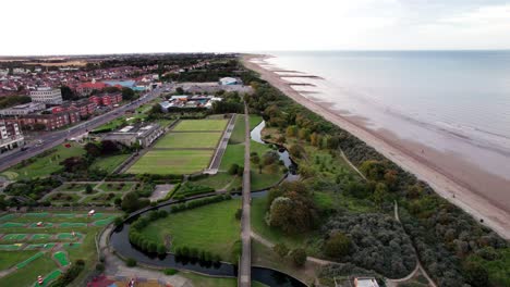 aerial video footage displays the elegance of a sunset over skegness, a delightful seaside town in the uk, showcasing the town, promenade, pier, and coastline