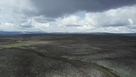 Huge-Nature-Flat-Terrain-Fronting-Mountains,-Aerial-Norway