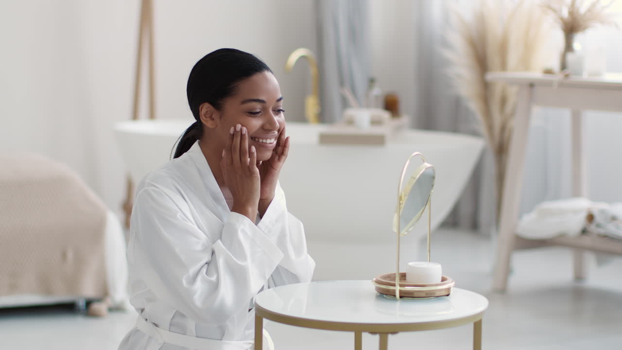 Woman Applying Skincare in Bathroom