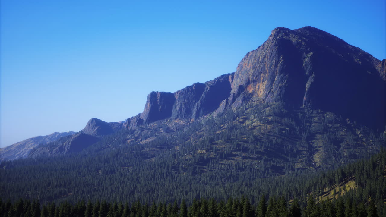 Majestic mountain landscape under a clear blue sky at midday