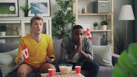 friends watching a canadian sports game