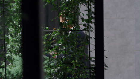 Calm business man going browsing digital tablet in urban office center outdoors.