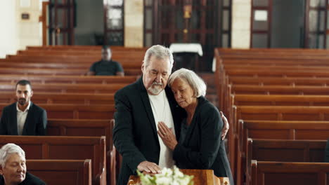 funeral, church and couple hug by coffin