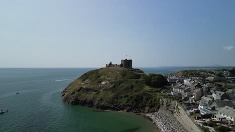 stunning criccieth castle on a lovely summer afternoon - aerial drone fast approach from far - north wales, uk