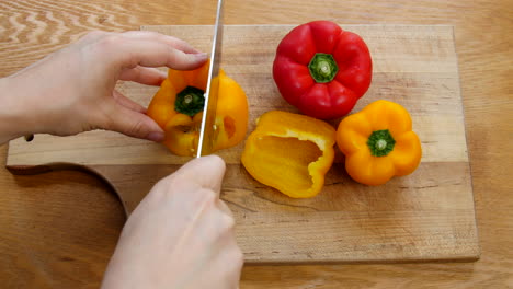 home cook slices bell peppers