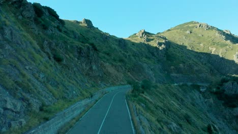 Aerial-view-of-a-shaded-mountain-road-in-Liguria,-Italy