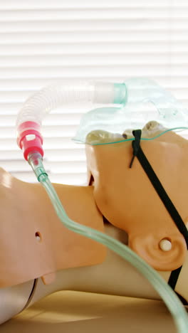 dummy patient simulated mannequin wearing oxygen mask