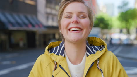 Closeup-portrait-of-a-young-smiling-woman-laughing