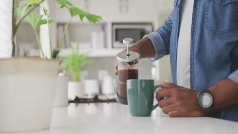 Video-of-african-american-senior-man-drinking-coffee
