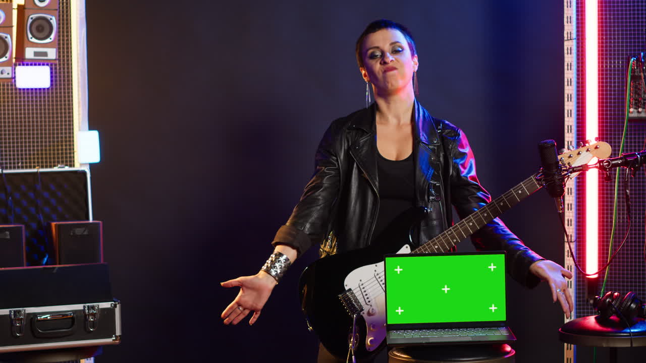 A woman playing electric guitar on stage