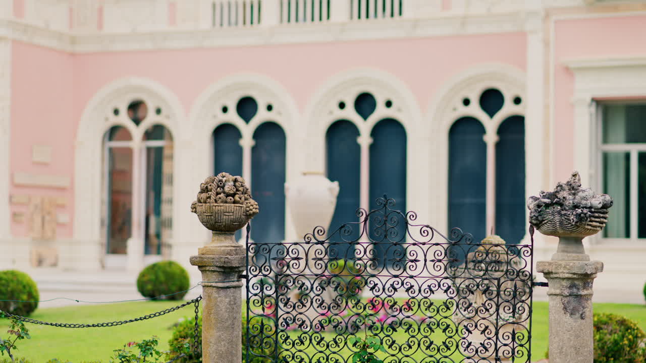 Close up of a decorative stone pillar in the courtyard of Villa Ephrussi de Rothschild with a blurred view on the background