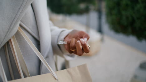 hand holding house keys outside closeup. real estate agent waiting rent client