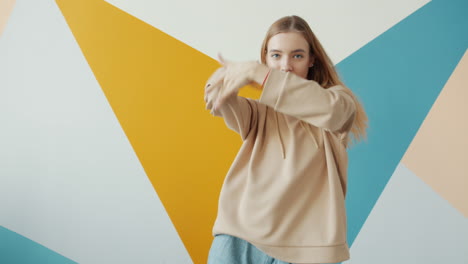 woman dancing in colorful geometric background