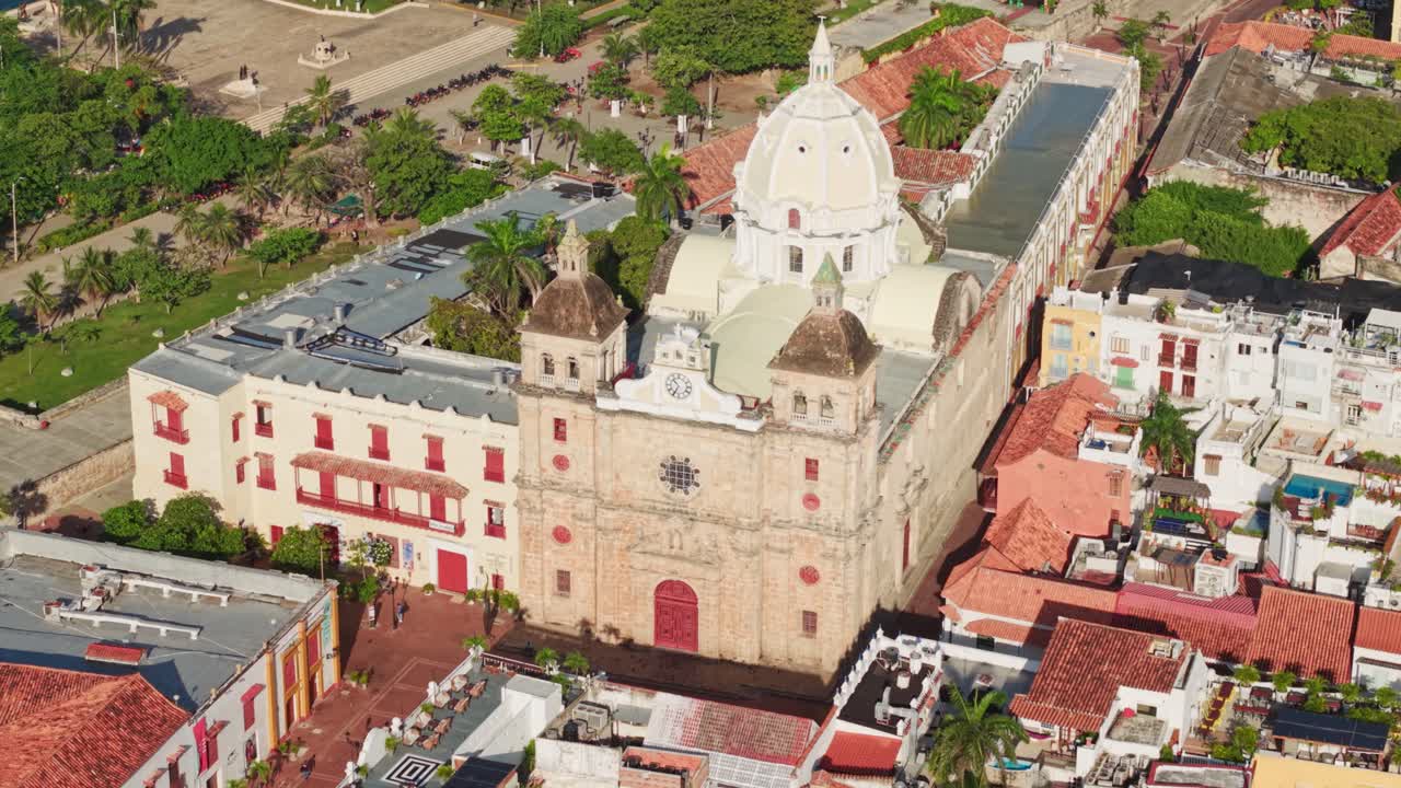 circle pan slow motion aerial view of the cathedral San Pedro Claver in cartagena, colombia