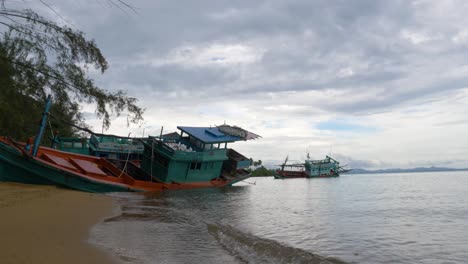 Old-wooden-fishing-boat-stranded-on-the-beach