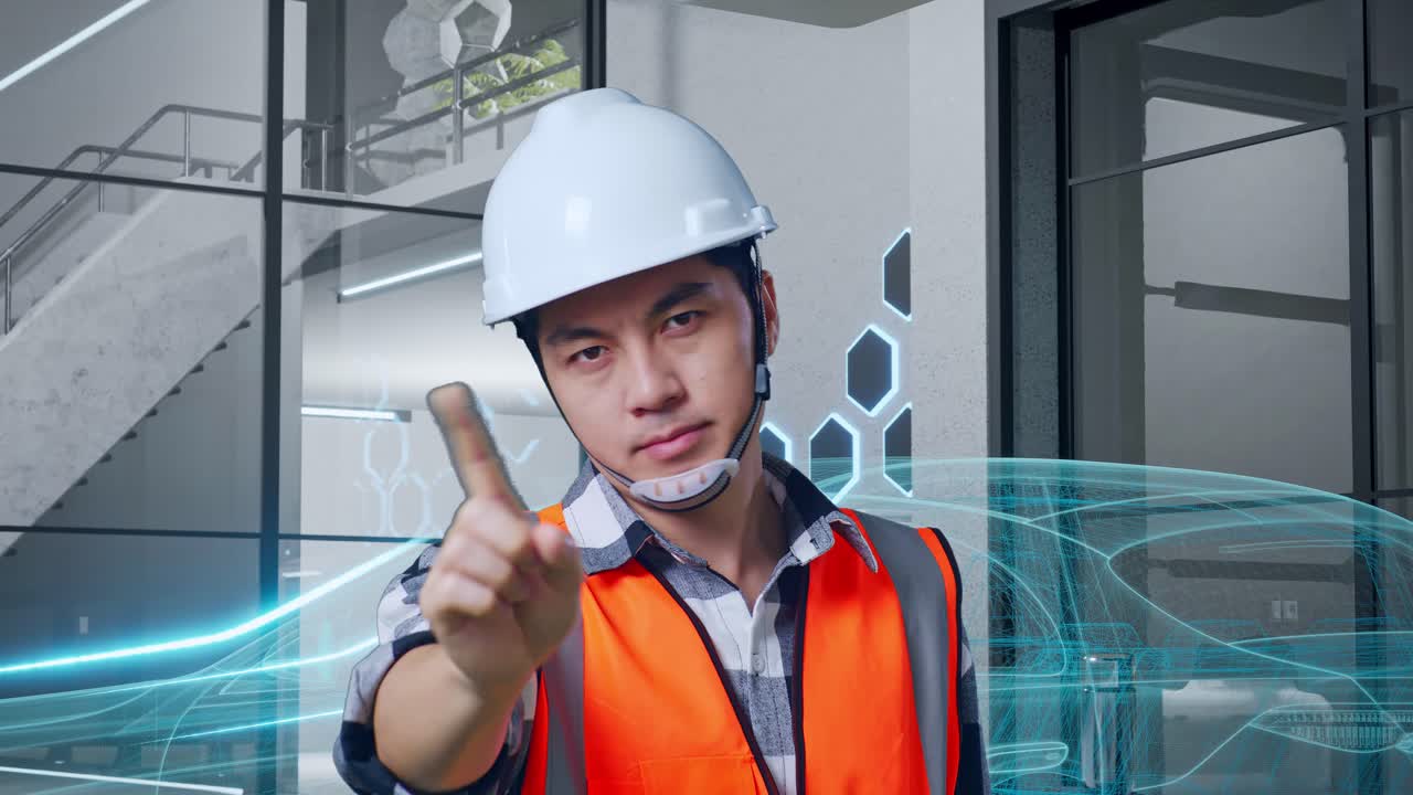 안전 헬을 입은 아시아 남성 엔지니어가 지표손가락 표시 없이 불쾌감을 표하면서 전기차, 첨단 산업 시설의 개념과 함께 서 있습니다.
