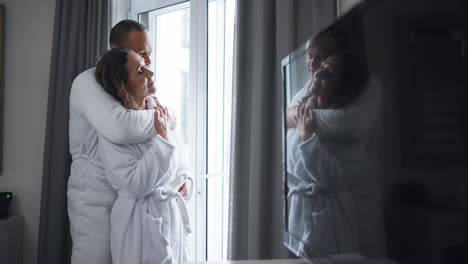 couple hugging in bathrobes
