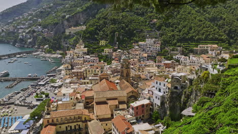 amalfi italy aerial v1 cinematic low drone flyover coastal cliffs and hillside neighborhood capturing charming town center featuring landmark church duomo di amalfi - shot with mavic 3 cine - may 2023