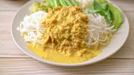 thai rice noodles with crab curry and variety vegetables - thai local southern food