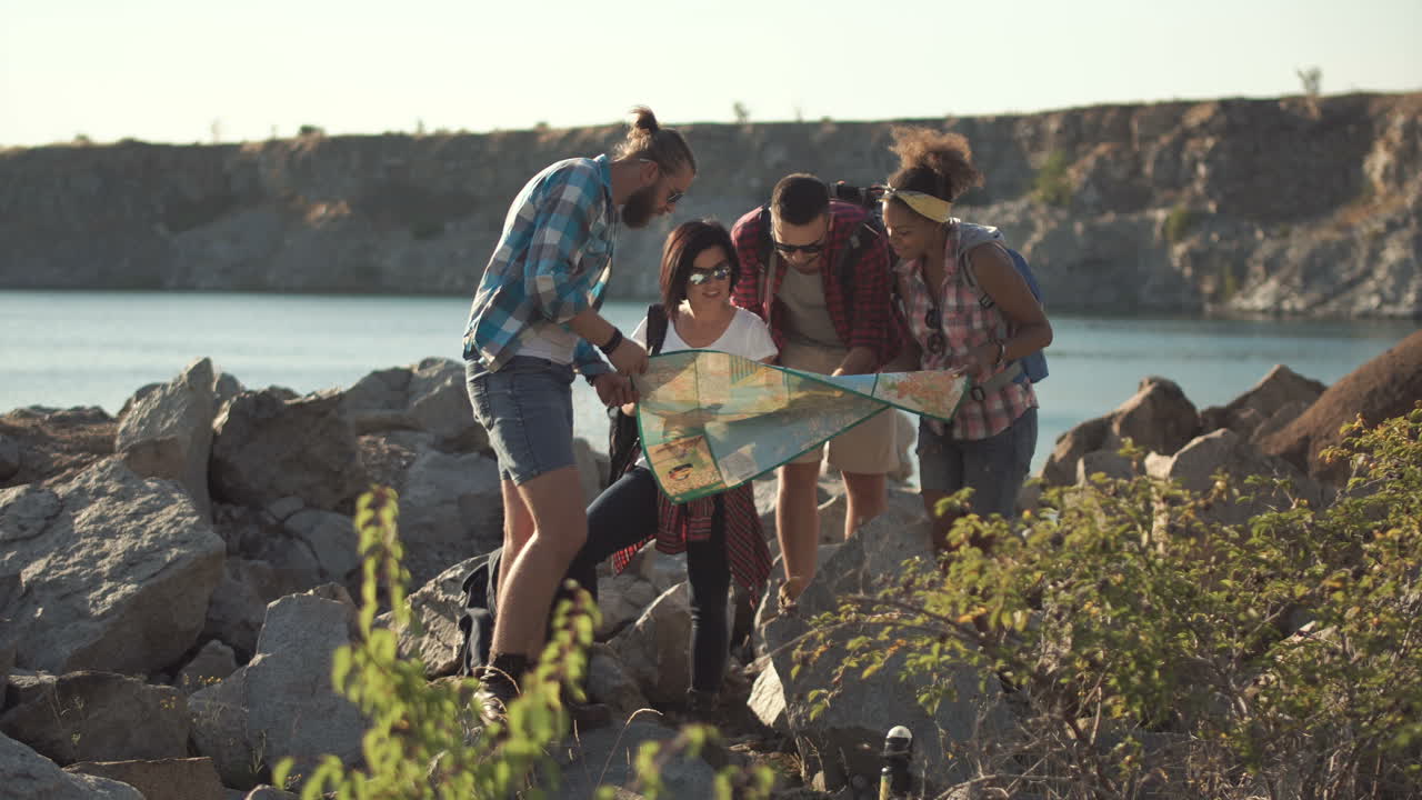 Group of tourists consult a map for directions
