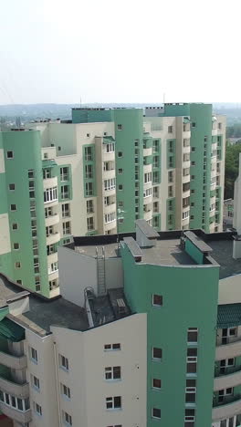 beautiful view opening of a modern building being built in a new residential complex. high-rise house apartment in the city. motion camera bottom top vertical video