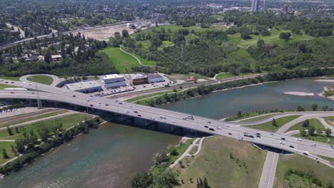 An-aerial-overhead-drove-flies-over-Crowchild-Trail-bridge-spanning-the-Bow-River-in-Calgary-Alberta