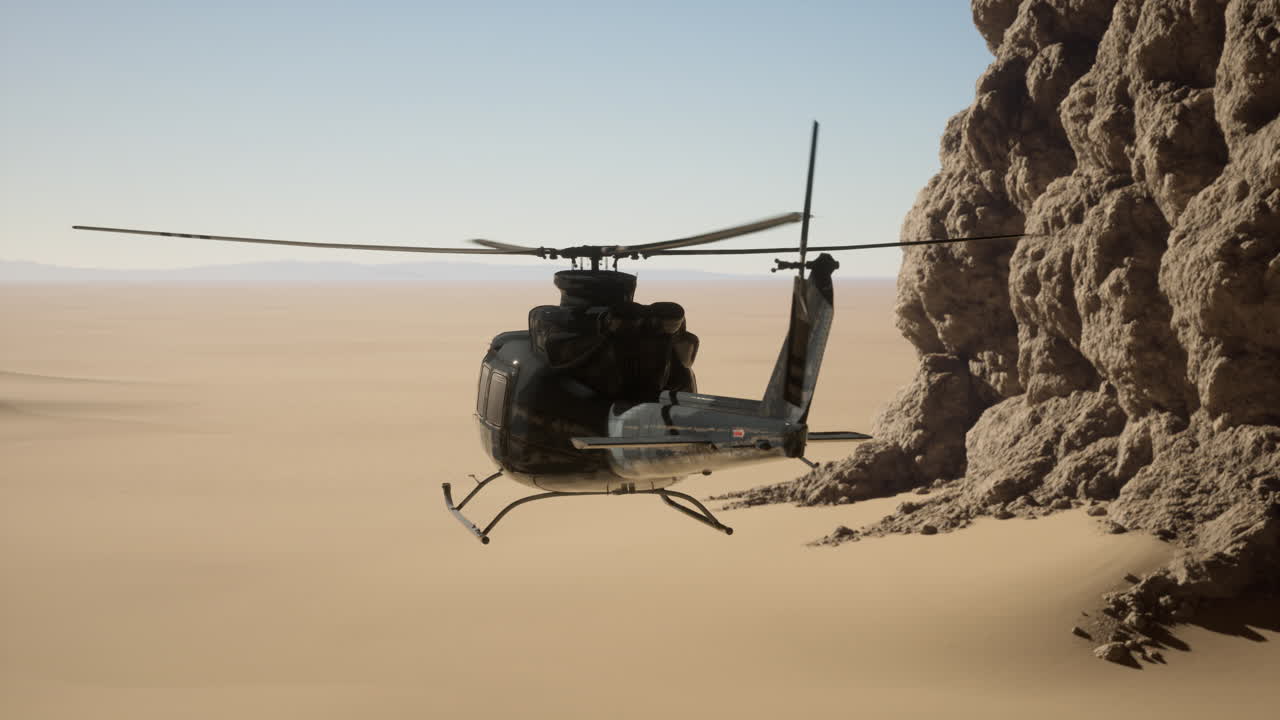 helicóptero negro volando sobre un paisaje desértico