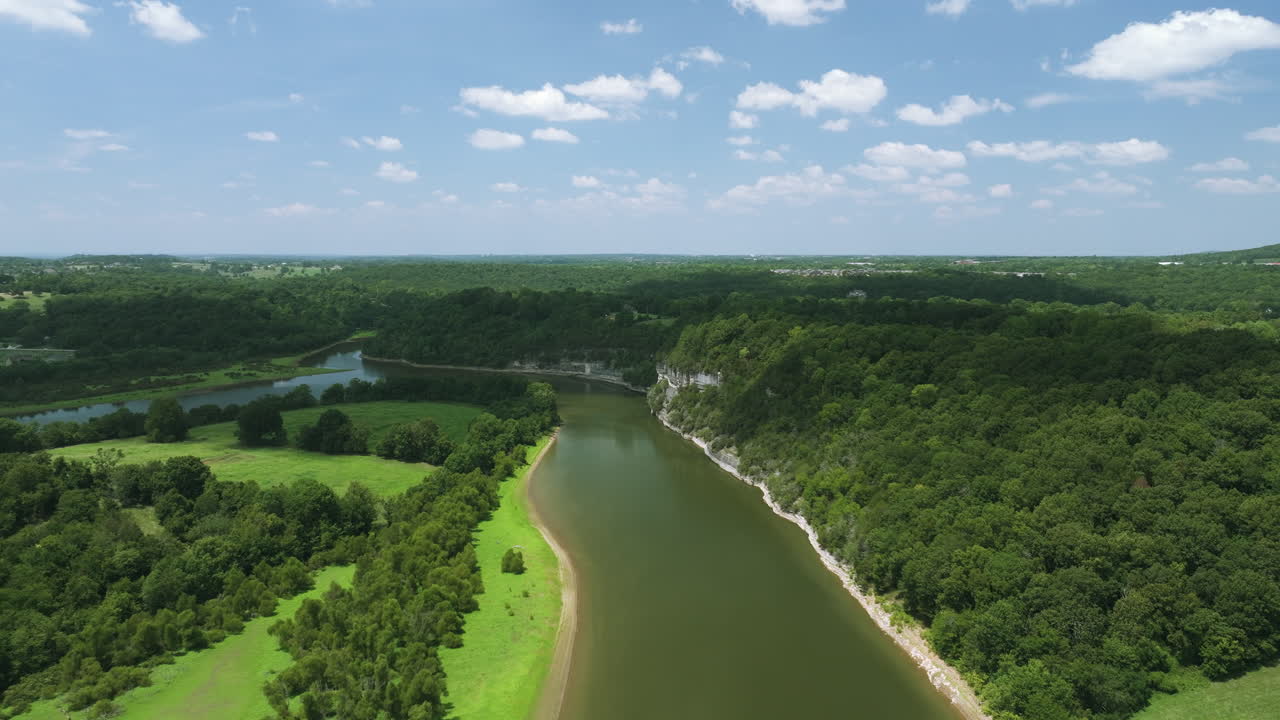 Scenic aerial view of lush green forests and a tranquil river at Beaver Lake, Arkansas